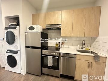 Boston apartment for rent - A kitchen with wooden cabinets and stainless steel appliances is for sale.