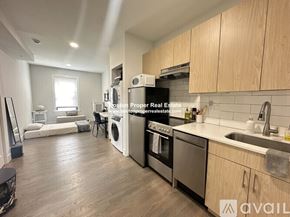 Boston apartment for rent - A kitchen with a washer and dryer built in.