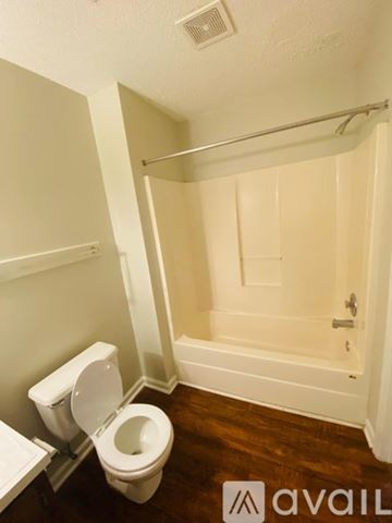 Greenville apartment for rent - A small kitchen with a white refrigerator and a white sink.