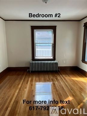 Boston apartment for rent - Bedroom #2 with a window and a radiator on the floor.