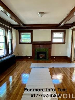 Boston apartment for rent - A living room with a fireplace and a large rug.