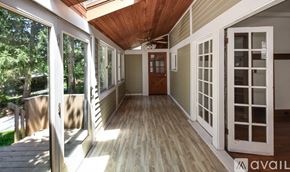 Cleveland Heights house for rent - A sunny day in a house with a wooden deck and sliding glass doors.