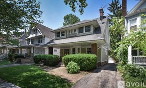Cleveland Heights house for rent - A house with a well-maintained lawn and a driveway leading to the front door.