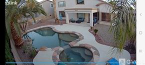 Surprise house for rent - A pool with a hot tub in the middle of it.