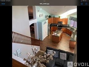 Surprise house for rent - A modern kitchen with wooden floors and a large island.