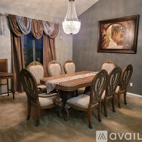 Surprise house for rent - A dining room with a table and chairs.