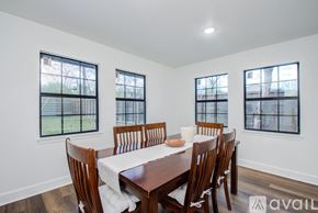 Houston house for rent - A dining room with a table set for six.