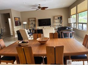 Surprise apartment for rent - A dining room with a wooden table and chairs.