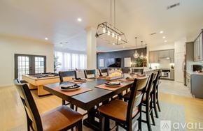 Houston townhouse for rent - A modern dining room with a large table and chairs.