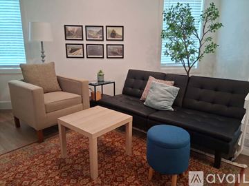 Altoona apartment for rent - A modern living room with a dining table and chairs.