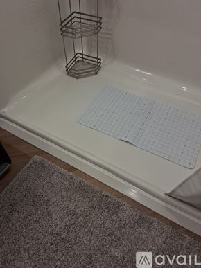 Altoona apartment for rent - A set of barbecue tools including tongs, a spatula, and a grill brush are neatly organized in a drawer.
