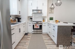Los Angeles house for rent - A modern kitchen with white cabinets and a central island.