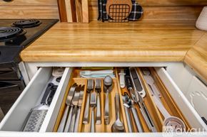 Jacksonville house for rent - A drawer full of silverware and utensils in a kitchen.