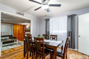 Jacksonville house for rent - A dining room with a wooden table and chairs.