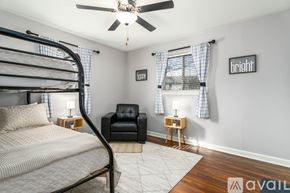 Jacksonville house for rent - A bedroom with a bunk bed and a chair.