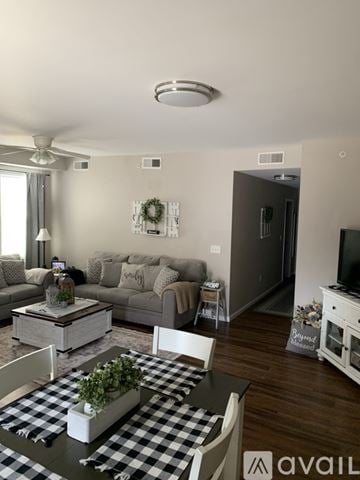 Cincinnati apartment for rent - A living room with a checkered table and a grey couch.