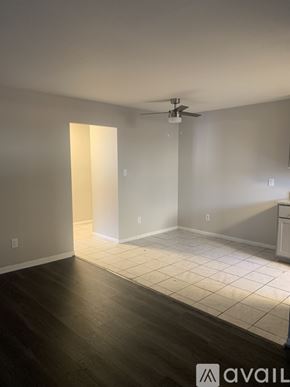 Cincinnati apartment for rent - A room with a ceiling fan and a light on the wall.