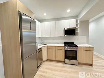 Chicago apartment for rent - A modern kitchen with wooden cabinets and stainless steel appliances.