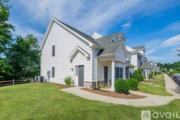 Millersville apartment for rent - A kitchen with wooden cabinets and a white refrigerator.