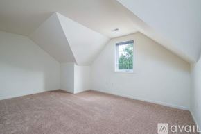 Millersville apartment for rent - A large empty room with a carpeted floor and white walls.