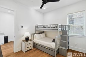 Dallas townhouse for rent - A bedroom with a bunk bed and a ceiling fan.