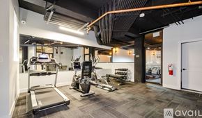 Chicago apartment for rent - A gym with treadmills, weights, and exercise machines.