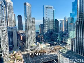 Chicago apartment for rent - A cityscape with the word "ONE" prominently displayed on a building.