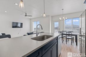 Lehi apartment for rent - A modern kitchen with a large island and a view of the ocean.