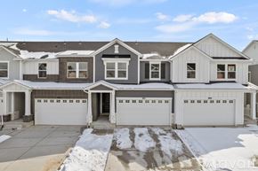 Lehi apartment for rent - A large, two-story house with a garage and a driveway.