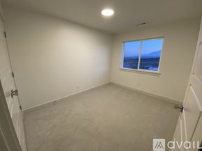 Lehi apartment for rent - A room with a window overlooking the ocean.