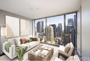 Chicago condo for rent - A living room with a view of the city skyline.