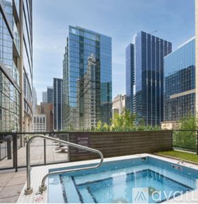 Chicago condo for rent - A pool on a balcony with a view of the city.