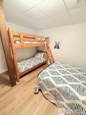 Clayton house for rent - A bedroom with a bunk bed and a single bed.