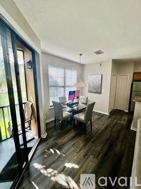 Sarasota apartment for rent - A dining room with a table and chairs is shown.