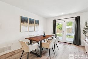 Irving house for rent - A dining room with a wooden table and chairs.