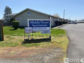 Salem apartment for rent - A sign for Middle Grove Apartments is displayed in front of a building.