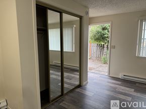 Salem apartment for rent - A room with a sliding glass door leading to a backyard.