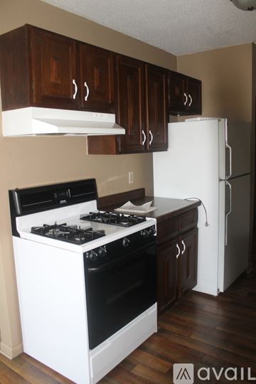 Willmar apartment for rent - A kitchen with a white stove and black oven.