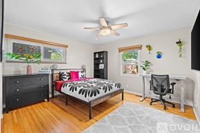 Albuquerque apartment for rent - A bedroom with a bed, desk, and chair.