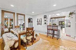 Albuquerque apartment for rent - A dining room with a wooden table and chairs.