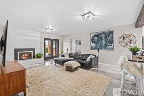 Albuquerque apartment for rent - A living room with a fireplace and a couch.