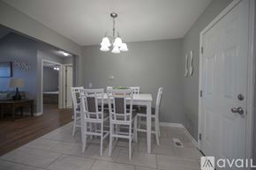 Murfreesboro house for rent - A dining room with a white table and chairs.