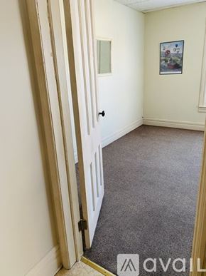 Glens Falls apartment for rent - A room with a carpeted floor and a door.