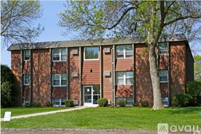 North Mankato apartment for rent - A brick building with a tree in front of it.