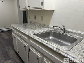 Salem apartment for rent - A kitchen with a granite countertop and a stainless steel sink.