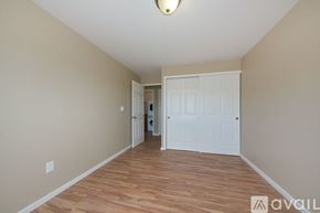 Seattle apartment for rent - A room with wooden floors and a white door.