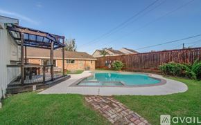 Houston house for rent - A backyard with a pool and a deck.