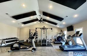 Waynesville apartment for rent - A spacious home gym with a variety of exercise equipment.
