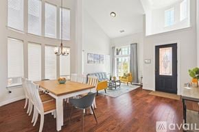 Irving house for rent - A dining room with a wooden table and chairs.