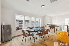 Irving house for rent - A room with a pool table and chairs.
